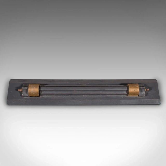 This is an antique draughtsman's rolling ruler. An English, nitrided bronze cartographer's instrument by Stanley of...