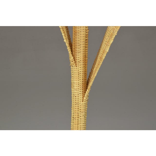 An exceptional handmade table lamp entirely handwoven in naturally sourced wicker. This rare form of workmanship takes a...