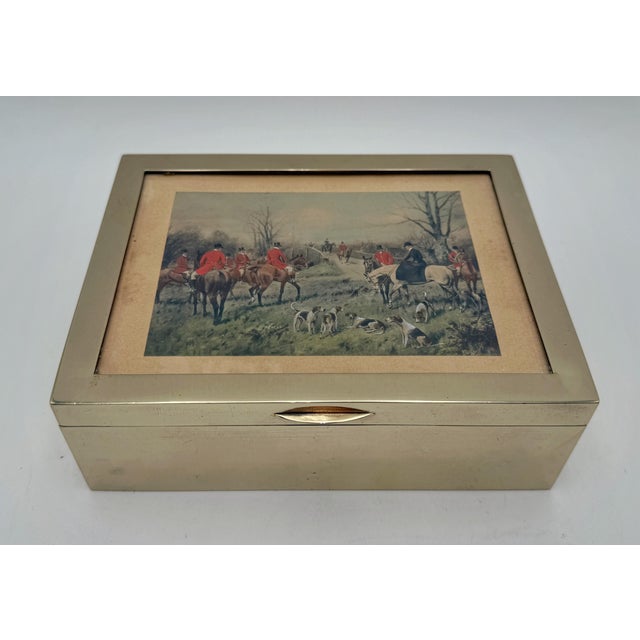 A beautifully understated vintage silver plate presentation box or tabletop humidor featuring a classic English fox...
