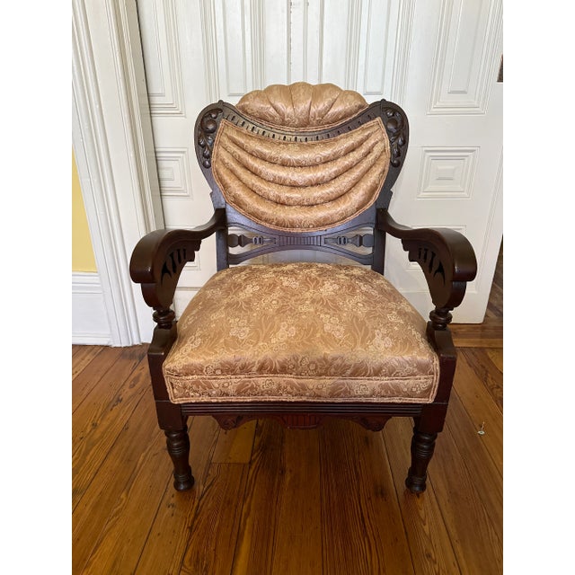 This is a very unique and interesting parlor chair. The draped tufting is quite out of the ordinary. The chair has been...