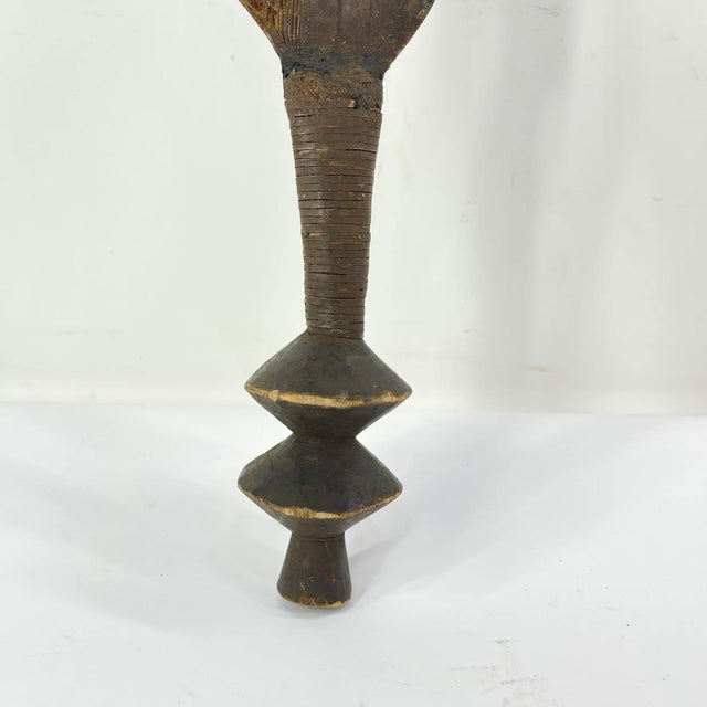 The Ngombe Executionerâs Prestige Knife Currency from the Congo is a powerful and visually striking object that embodies...