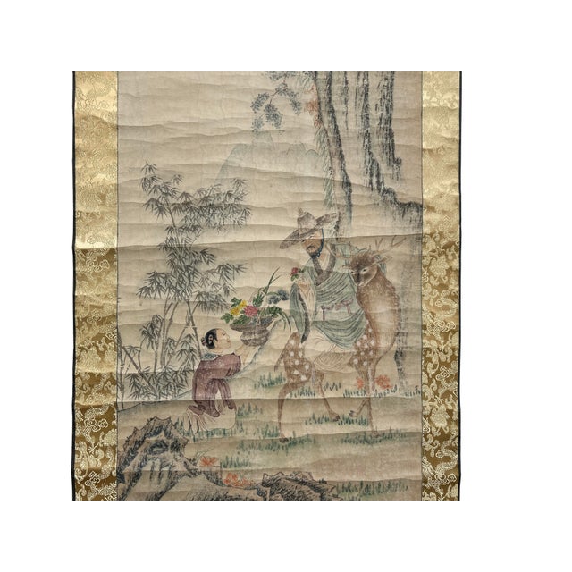 This exquisite vintage Chinese ink brush scroll painting, featuring an old man and a kid with a deer theme, is a...