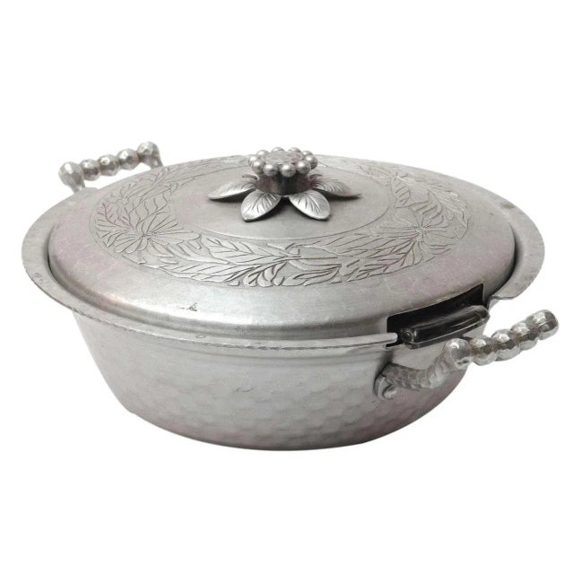 This is a pair of hand-forged aluminum lunchboxes.