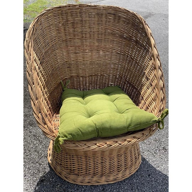 This is a vintage rattan egg chair. It is just waiting to be added to your home seating area with a swag lamp, shag rug,...
