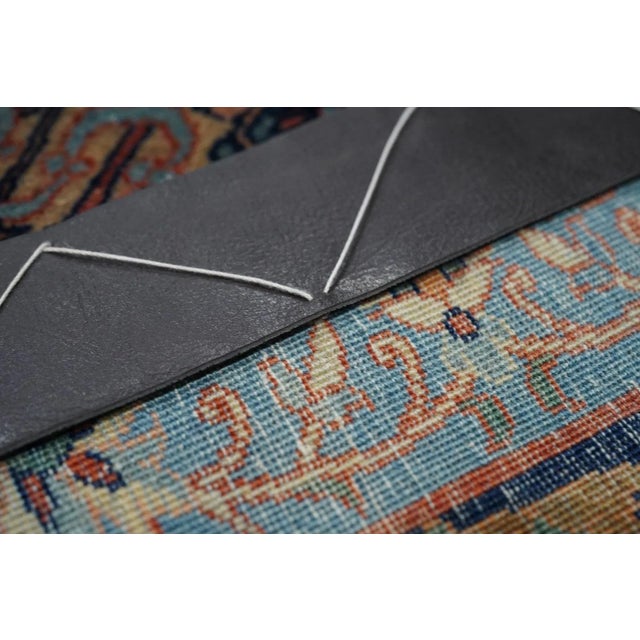 This unusual early 20th century central Persian town scatter shows a rusty salmon field very closely covered with a four...