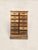 A charming antique pine multi-drawer cabinet, circa 1900, with twelve small drawers, warm aged patina, and classic brass...