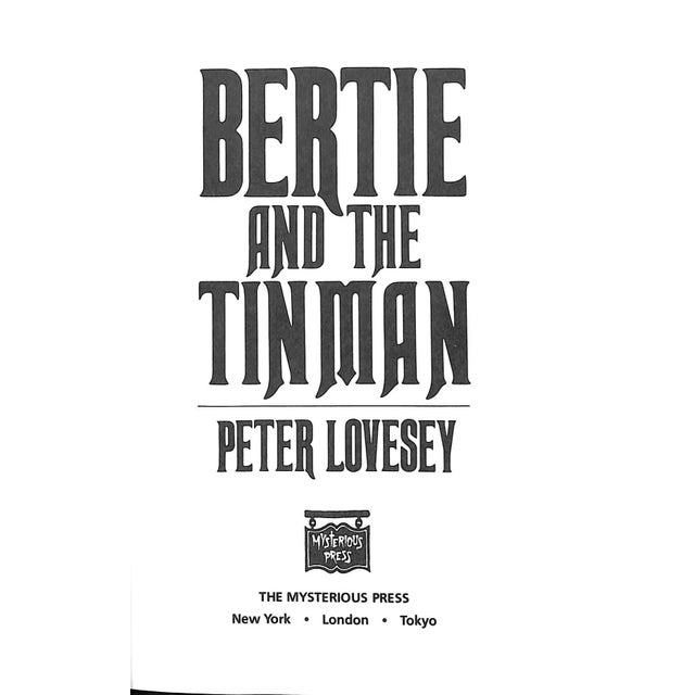 LOVESEY, Peter [212] pp. The Mysterious Press 1988 8 3/4" x 5 3/4" Jacket design by George Corsillo "Bertie and the Tin...