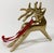 This solid brass reindeer ornament features a beautiful patina and cranberry red ribbon for hanging. Leave as-is for a...