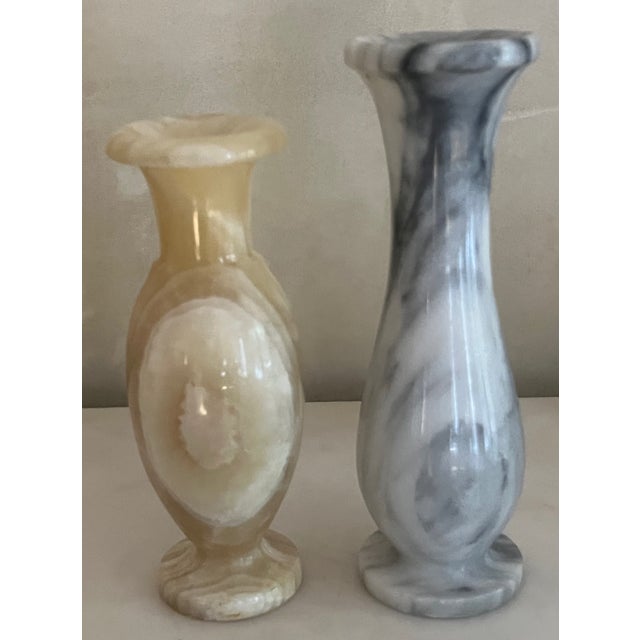 Set of two stone vases, gray and a buttery yellow/beige in color. Gray- 8" tall Beige- 7" tall