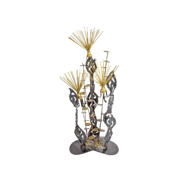 A Brutalist metal sculpture by the artist D. Pascoe. This sculpture features three metal, abstract plant-like forms...