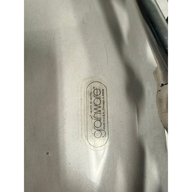 This elegant Grainware serving tray features a clear lucite body with distinctive golf club-shaped handles in silver tone,...
