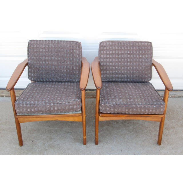 2 vintage Danish Modern / mid century modern wooden lounge chairs. The chairs are believed to be walnut. No maker mark or...