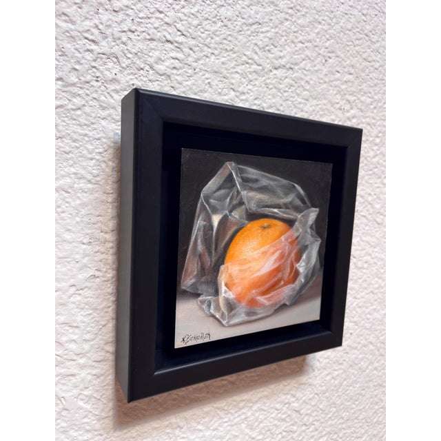 Orange Wrapped in Plastic by Kelly Birkenruth | Oil on Panel Still life of an orange in plastic wrap For Sale - Image 4 of 5