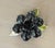 A great 1960’s black and green flower brooch. Shading appropriate to age as seen in photos…adds silver shine and character!