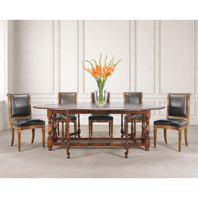A handsome set of six labeled dining chairs designed by Michael Taylor Designs, San Francisco, CA. The rare chairs are...