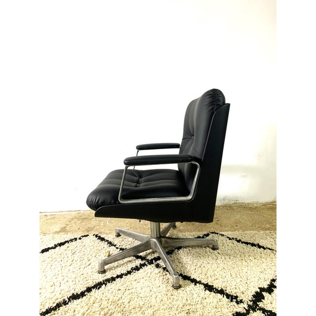 Executive Office Chair made by Vaghi 1960s. The chair has very broad armrests and an aluminum frame . Reupholstered with...