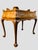 Beautiful Italian Burlwood Tea Table with one paper-lined drawer. Carved foliate shoulders with ornate brass hardware and...