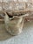 Vintage ceramic studio vessel, featuring a textured, speckled white and brown reactive glaze on a pale blue / green base....