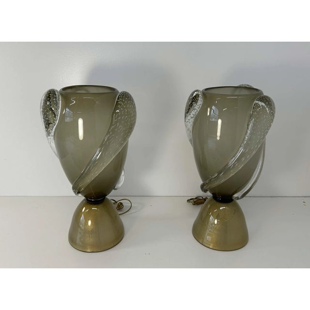 This pair of Art Deco style vase lamps was produced in Italy in the 2000s. They are completely made of grey Murano glass...