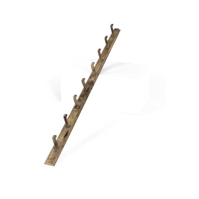A wonderful set of 19th century farmhouse pine coat hooks from an English country house. The moulded pine back board has a...