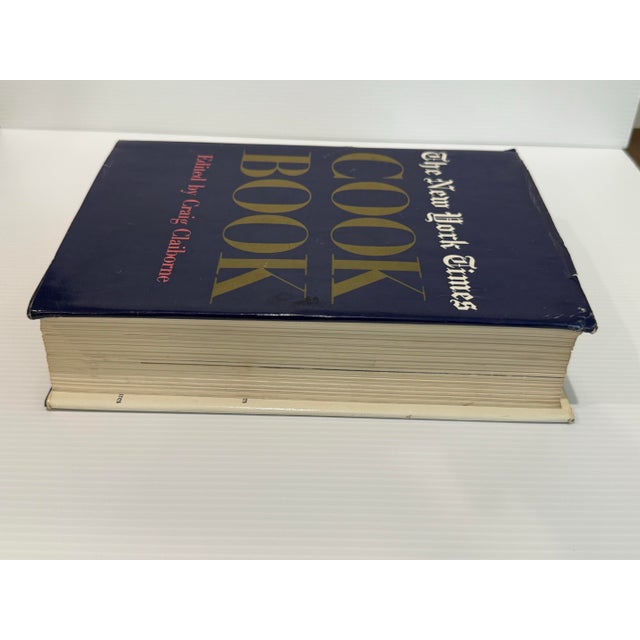 A collectible first edition of The New York Times Cook Book, edited by renowned food editor Craig Claiborne and published...