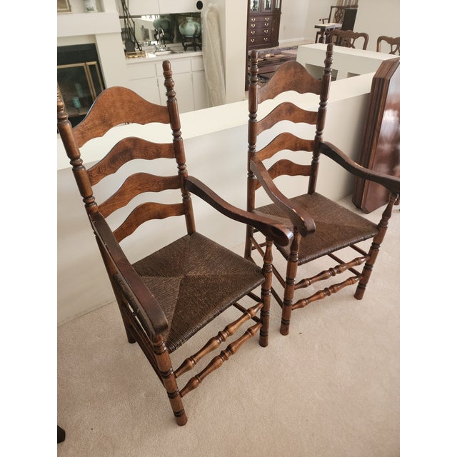 Two Hard Rock Maple Colonial Early American Ladderback Dining Arm Chairs withRush Seats