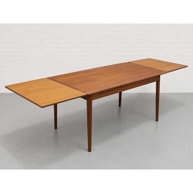 Danish Mid Century Modern TEAK DINING TABLE with two hidden leaves in a lovely streamlined size, perfect for smaller...