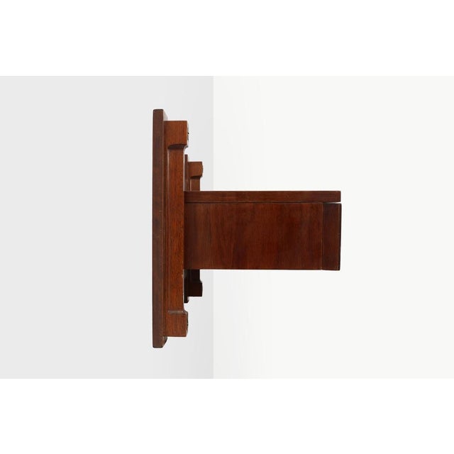 A refined example of Italian mid‑century design, this wall‑mounted console combines clean architectural lines with the...
