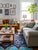 Contemporary Moroccan Rug | Handwoven Berber Wool Rug with Ocean Blue Field and Layered Pyramid Medallions This richly...