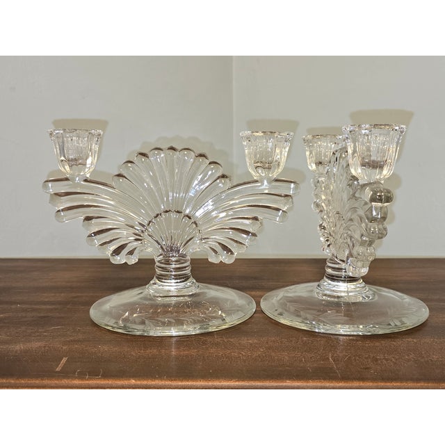 A lovely pair of vintage pressed‑glass candlesticks, featuring faceted stems, fluted candle cups, and beautifully etched...