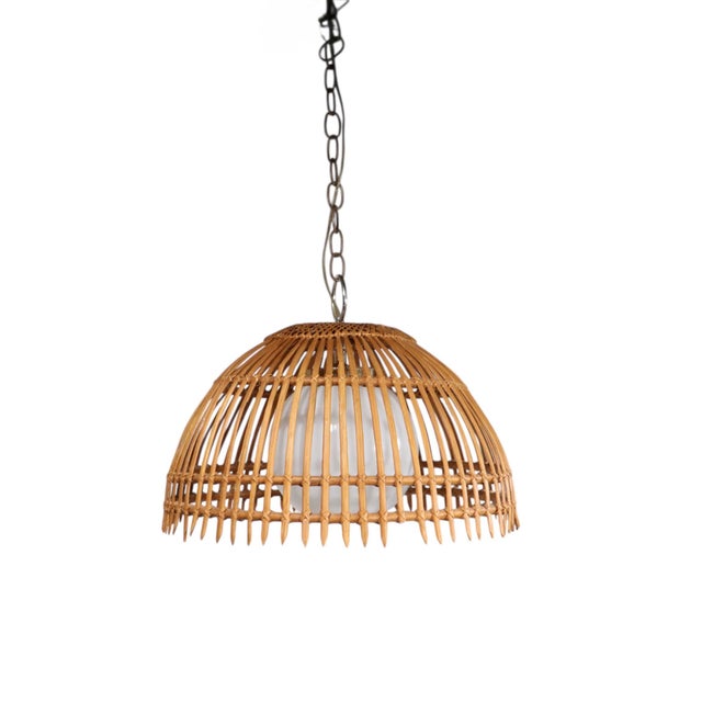 Mid Century, Coastal, Bohemian style hanging dome chandelier, circa 1970's. The fixture features repeating reeds, which...