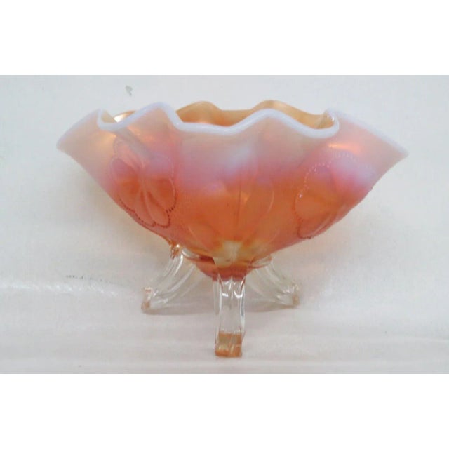 This charming bowl is made of carnival glass. This lovely bowl has a wonderful style; it features a unique oval shape with...