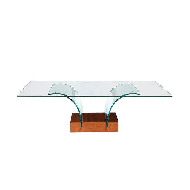 This Mid-Century Modernist cocktail table, designed in America circa 1960, is a masterful combination of organic curves...