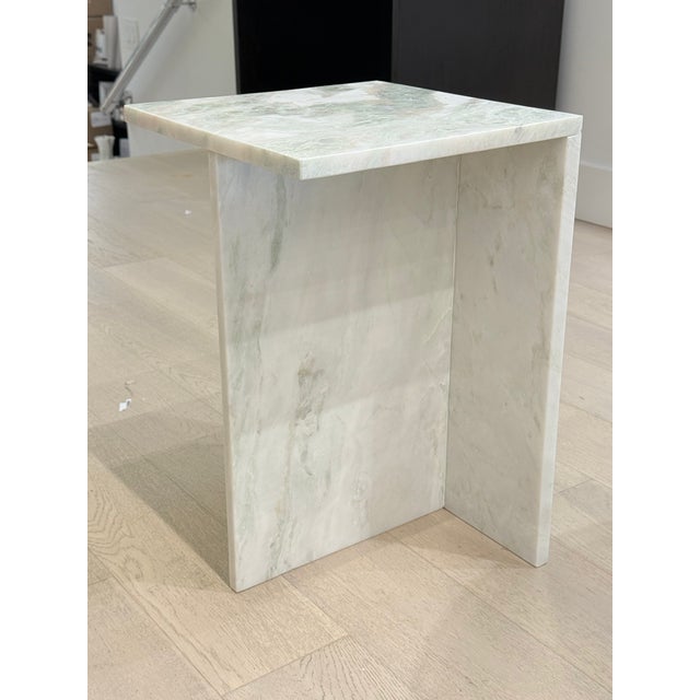 This Marbled Green Table is a refined accent piece that blends natural materiality with functional design. Crafted from...