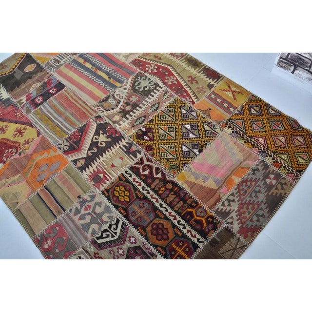 1950s Vintage Handwoven Turkish Patchwork Kilim Rug With Eclectic Tribal Motifs For Sale - Image 5 of 9