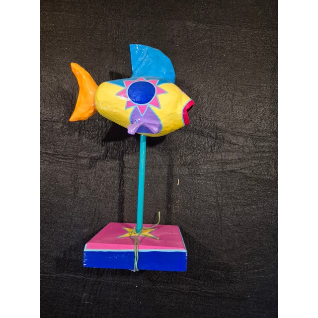 This is a handmade paper-mache fish sculpture from the "Whimsical Fish" collection by Mexican-born artist Arturo J. Garcia...