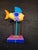 This is a handmade paper-mache fish sculpture from the "Whimsical Fish" collection by Mexican-born artist Arturo J. Garcia...