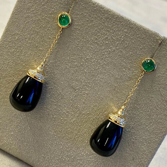 Created in 18 karat yellow gold Black Onyx Drops 20 carats approx. Emerald cabochons 0.50 carat approx. Diamonds 0.10...