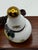 This is a very small painted porcelain snuff bottle with a string necklace attached so the bottle can be worn as a...