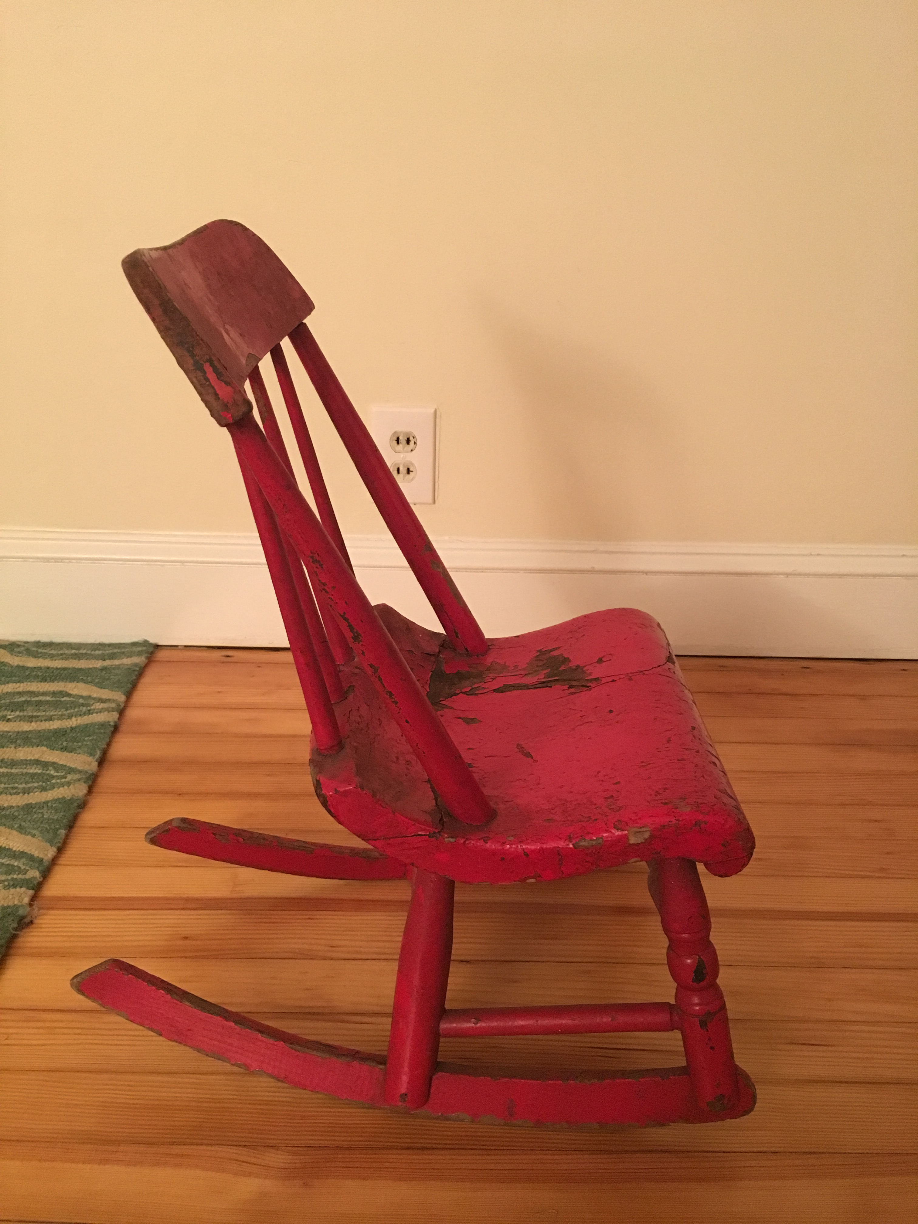 childs red rocking chair