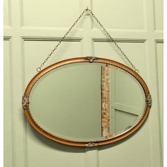 This is a very attractive Arts and Crafts piece, the copper frame is hand made with Art Nouveau stylised fleur-de-lys...