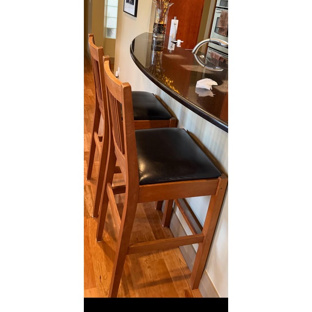 Beautiful pair of authentic Stickley Mission Oak bar stools in excellent condition. These were purchased new over 20 years...