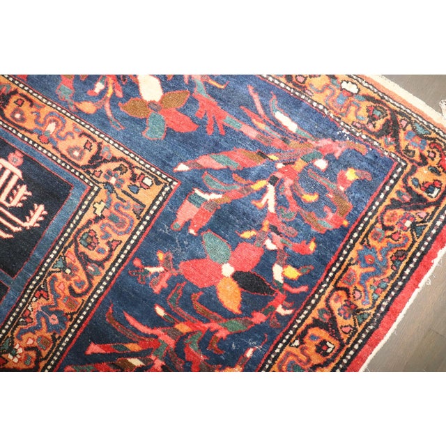 2nd quarter of the 20th Century Persian Bakhtiari Rug with a garden design on a navy ground