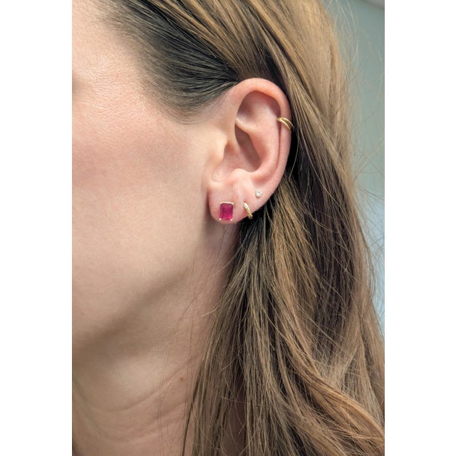 Elegant 7.5cts Madagascar ruby solitaire stud earrings, featuring rich red 10×8 mm oval gemstones. Set in solid 14k gold,...