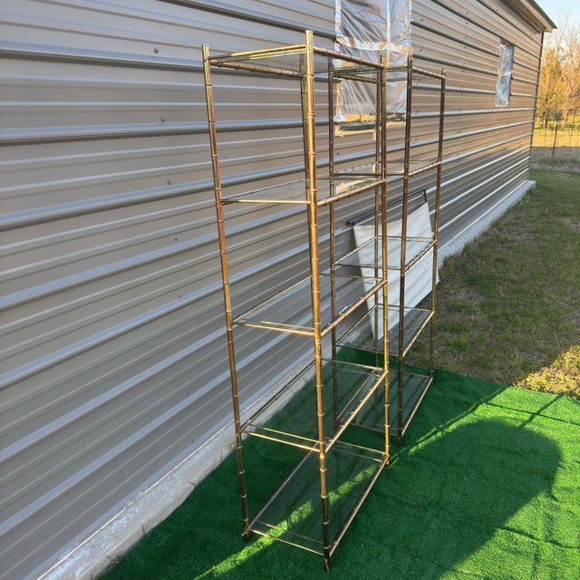 # Vintage Brass Faux Bamboo Étagères: Hollywood Regency Elegance These stunning matching brass faux bamboo étagères...