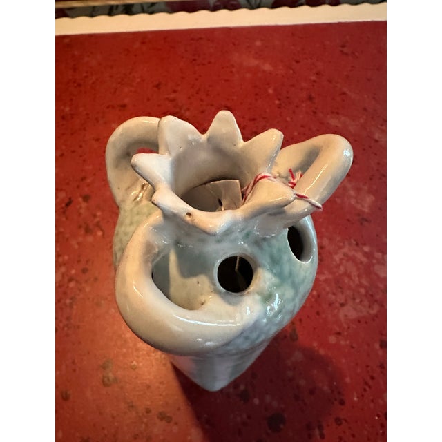 very well made ceramic case with multiple openings for flowers Hand painted and crafted