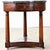 A 19th-century Empire-style gueridon with dark grey marble atop a mahogany base. The marble is punctuated with stunning...