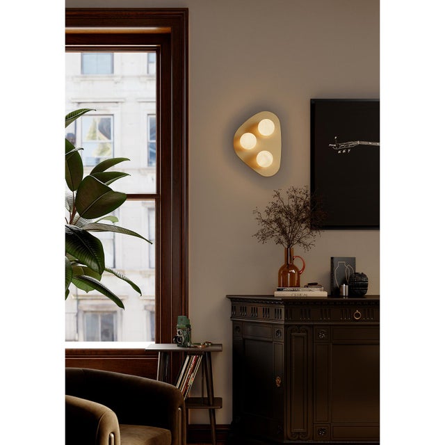 The Rhoads Flush Mount brings sculptural simplicity to the ceiling. Its softly curved triangular canopy cradles three...