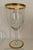 A set of 6 gold rimmed Art Deco wine glasses. The elegant, stemmed, hand blown glasses have faceted glass and the gold...
