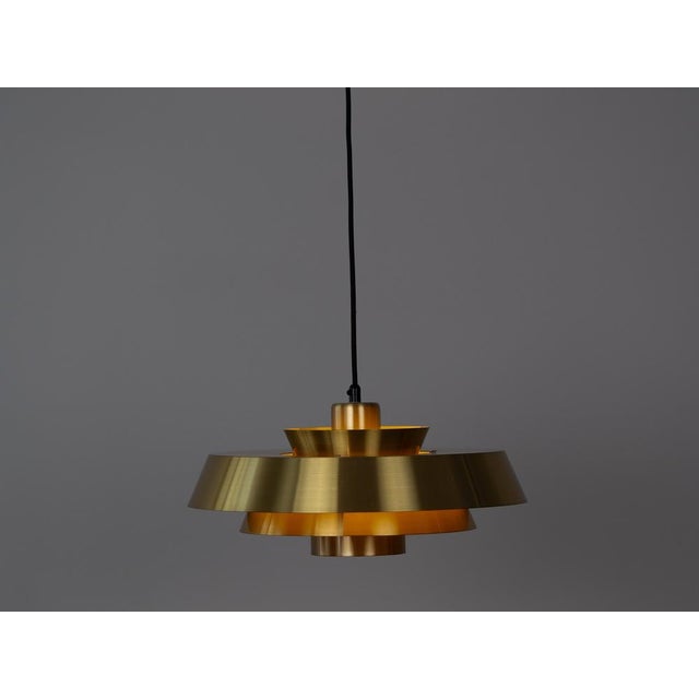 Nova brass lamp designed by Jo Hammerborg in 1963. When lit, the lamp provides a soft, glare-free downward glow, making it...